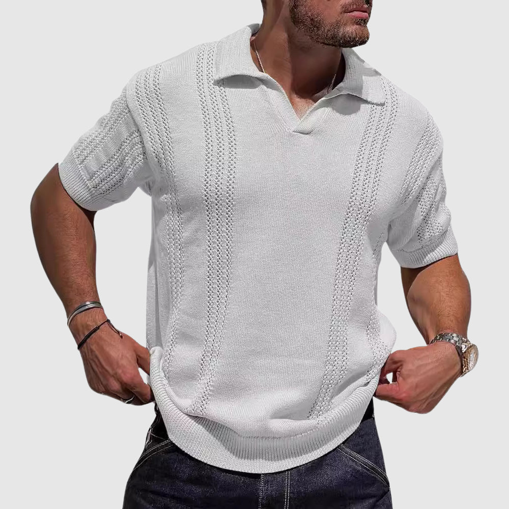  Male model in a relaxed textured polo with a clean open collar on a plain background