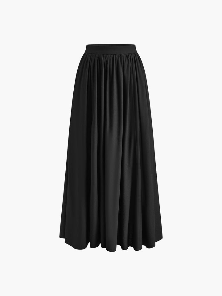 High waist pleated maxi skirt with a graceful silhouette on a plain background.