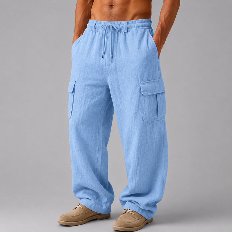 Male model wearing cropped drawstring pants on a plain background.