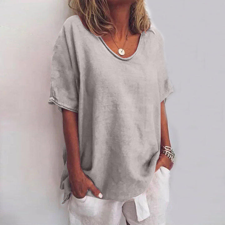 Lightweight blouse with model details on a clean background, showing a relaxed and elegant fit.