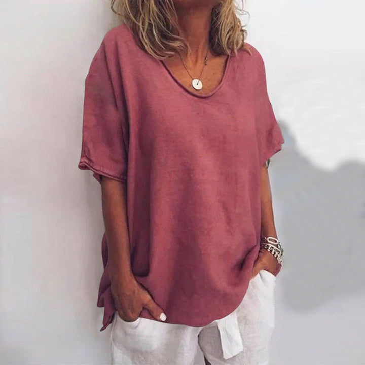 Minimalist blouse with model details on a clean background, styled for modern elegance.