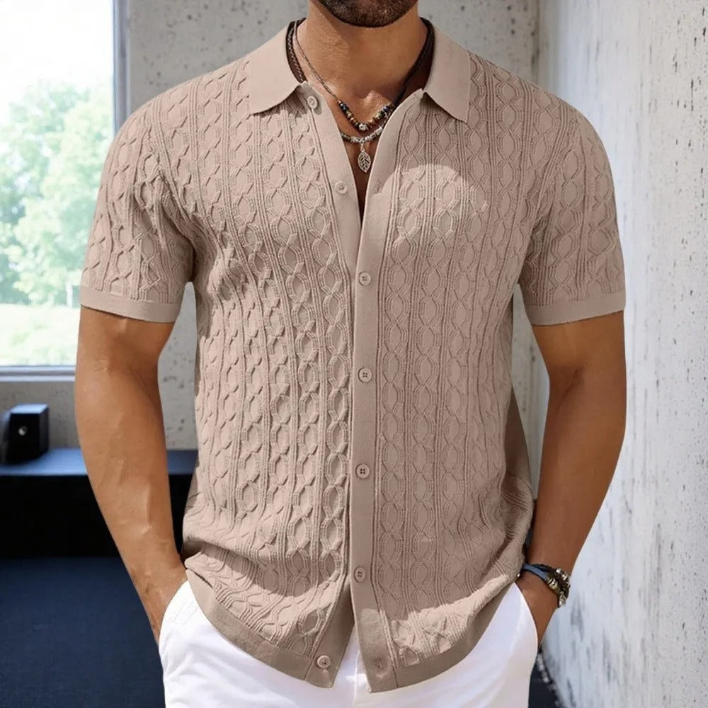  Male model wearing a casual textured polo top displayed on a plain background.