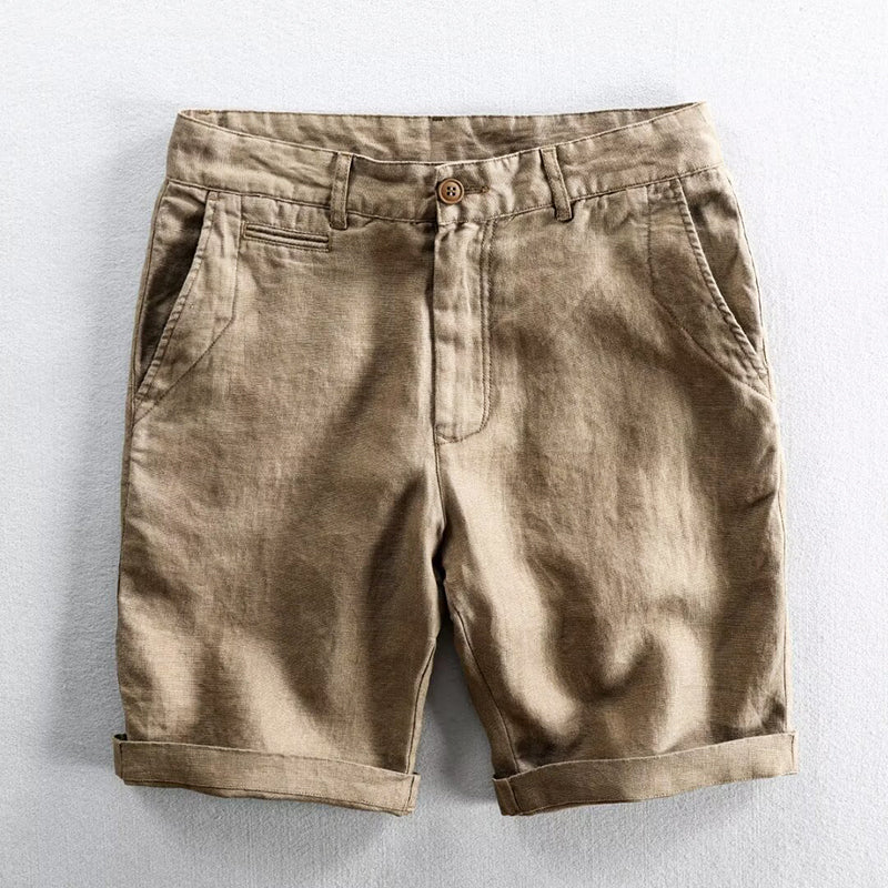 Casual rolled-hem shorts with a simple polished look on a plain background.