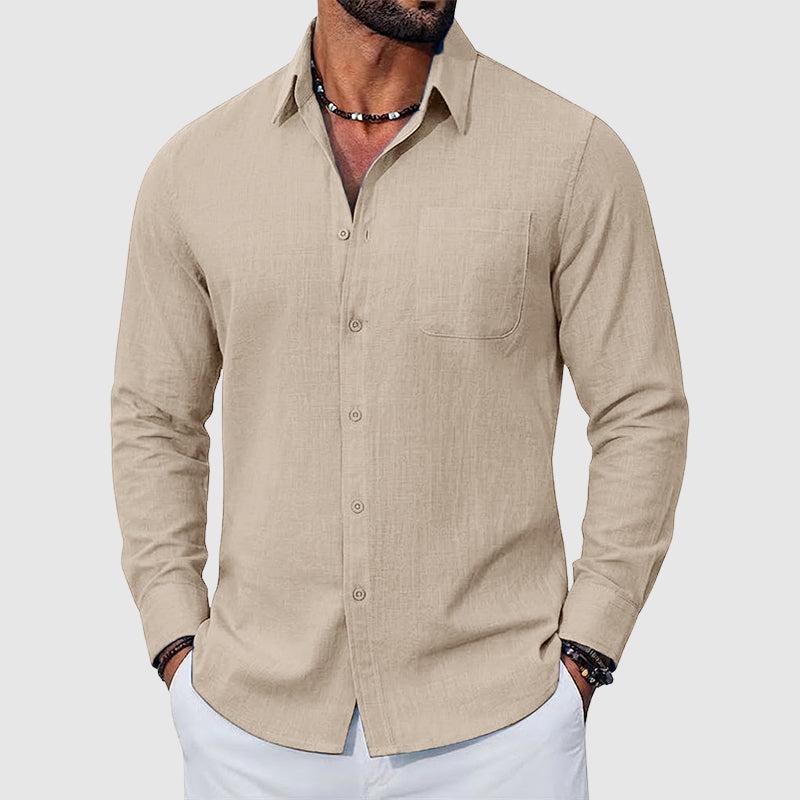  Female showcasing a lightweight woven shirt with a button-front design on a plain background.