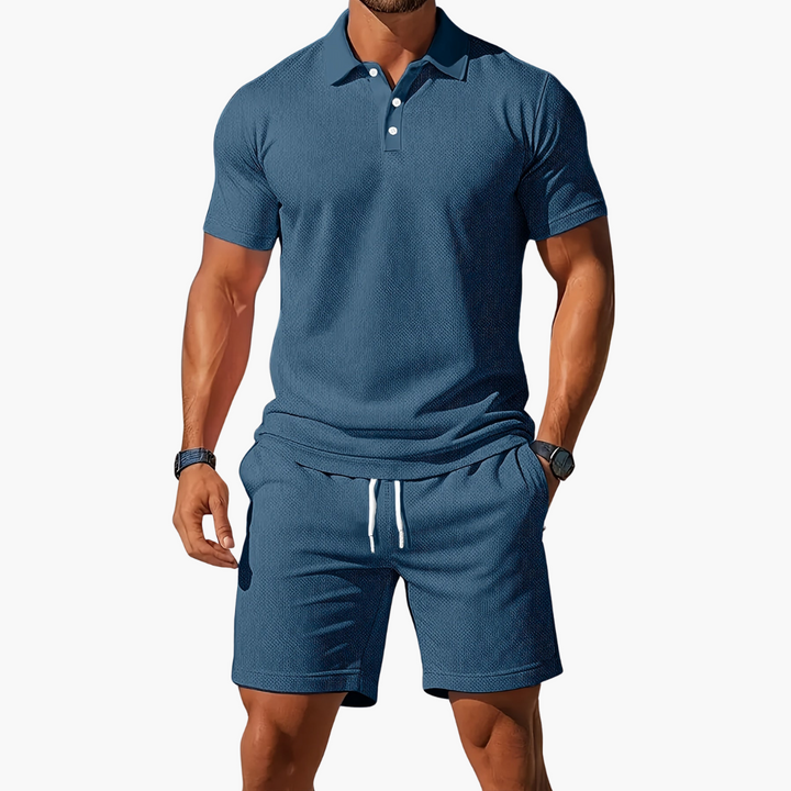  A model wears a collared button placket top with matching pull-on shorts on a plain background.