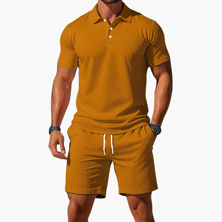  A model presents a casual men’s matching set with drawstring waist shorts on a plain background.