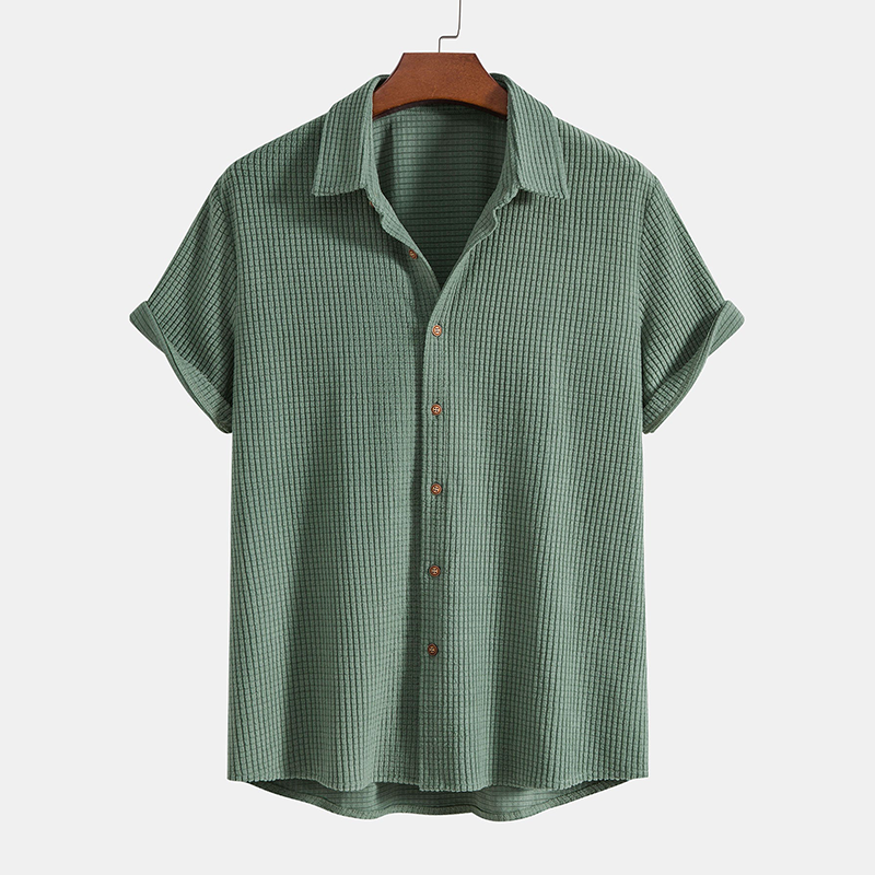 A matching short sleeve shirt and drawstring shorts set displayed on a plain background.