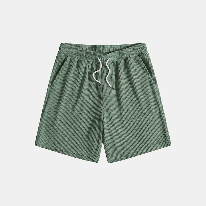 A matching short sleeve shirt and pull-on shorts set against a plain background.