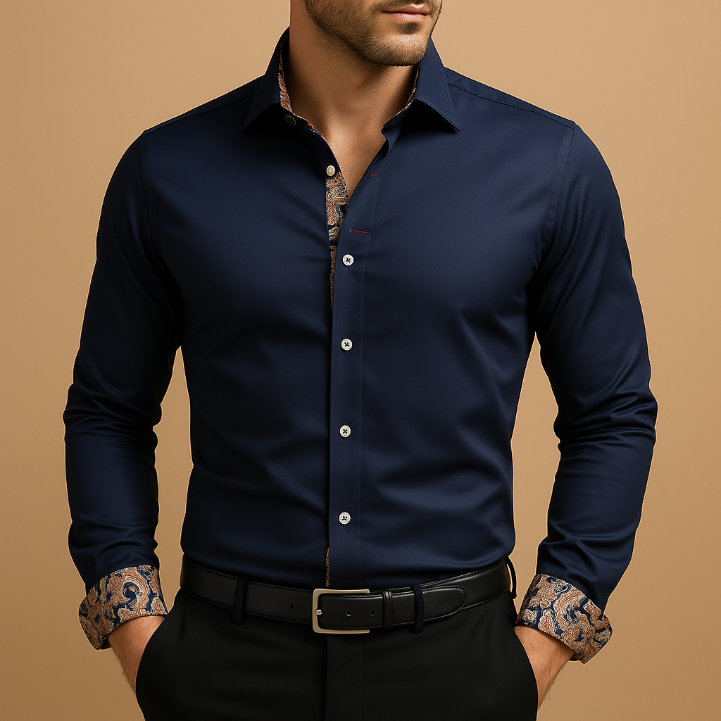 A smart-casual button-up shirt with patterned cuff accents against a plain background.