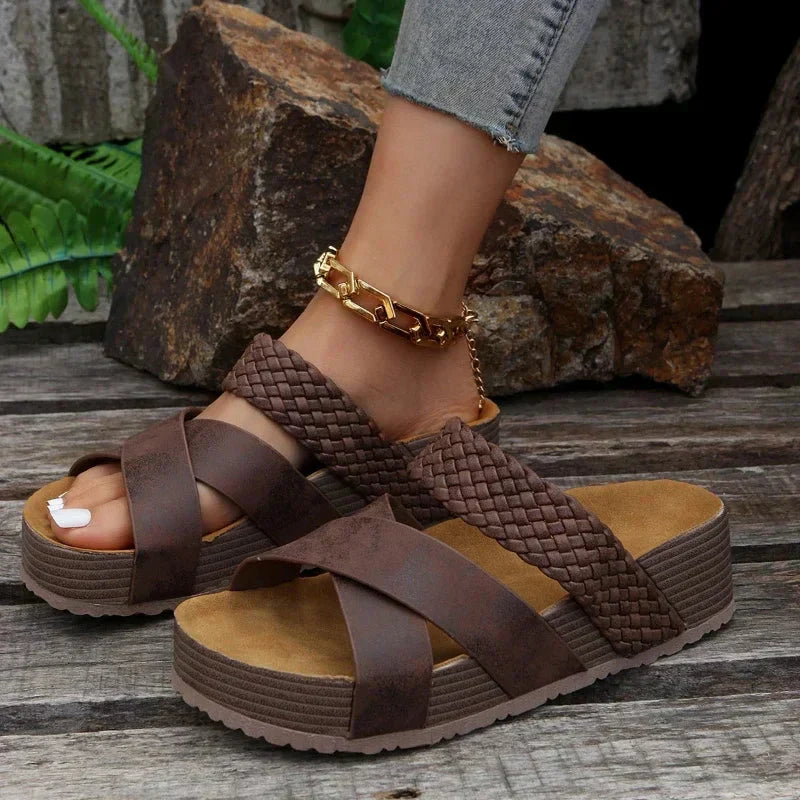 Close-up of foot in comfortable sandal on a clean background.