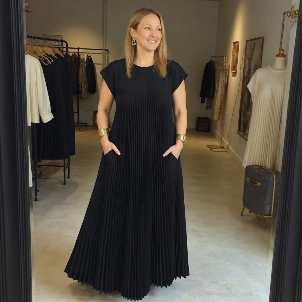Cocktail maxi dress with a defined waist displayed on a plain background.