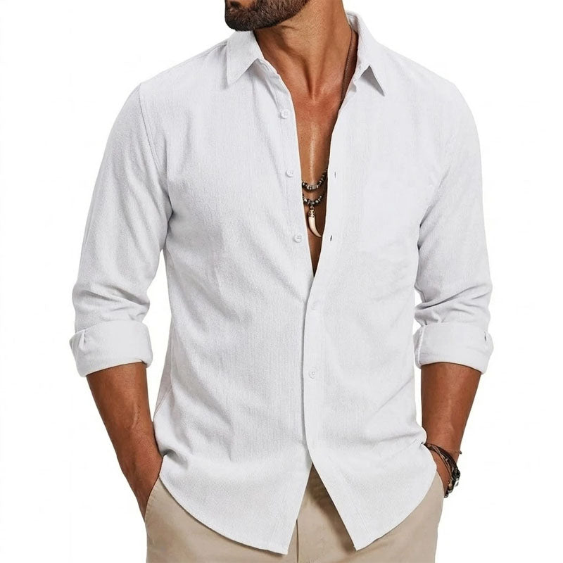  Male model wearing a navy smart-casual shirt with white detailing on a plain background.