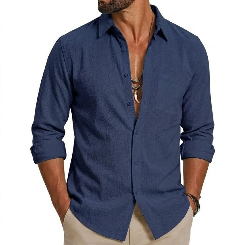 Male model displaying a navy contrast shirt with a structured collar against a plain background.