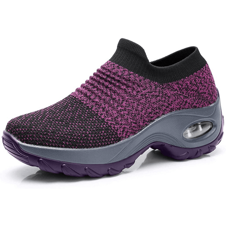 Comfortable women’s shoes displayed on feet with a minimal plain background.