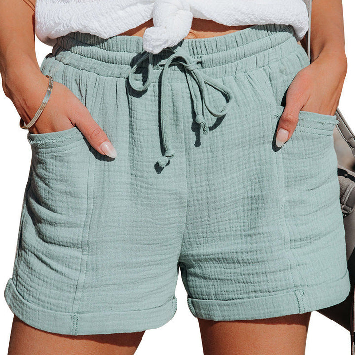  Woman in breathable shorts designed for daily comfort on a plain background.