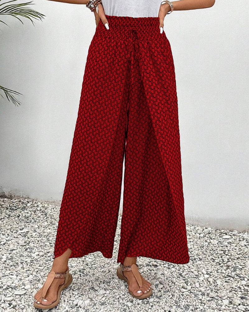 Comfortable wide-leg trousers with a balanced shape on a plain background.