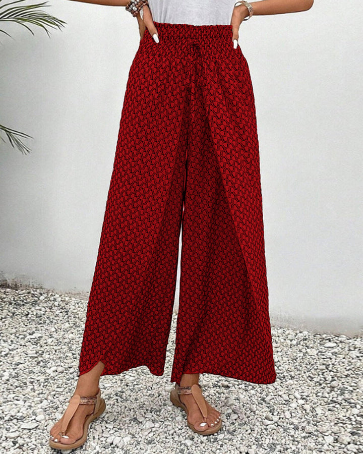 Comfortable wide-leg trousers with a balanced shape on a plain background.