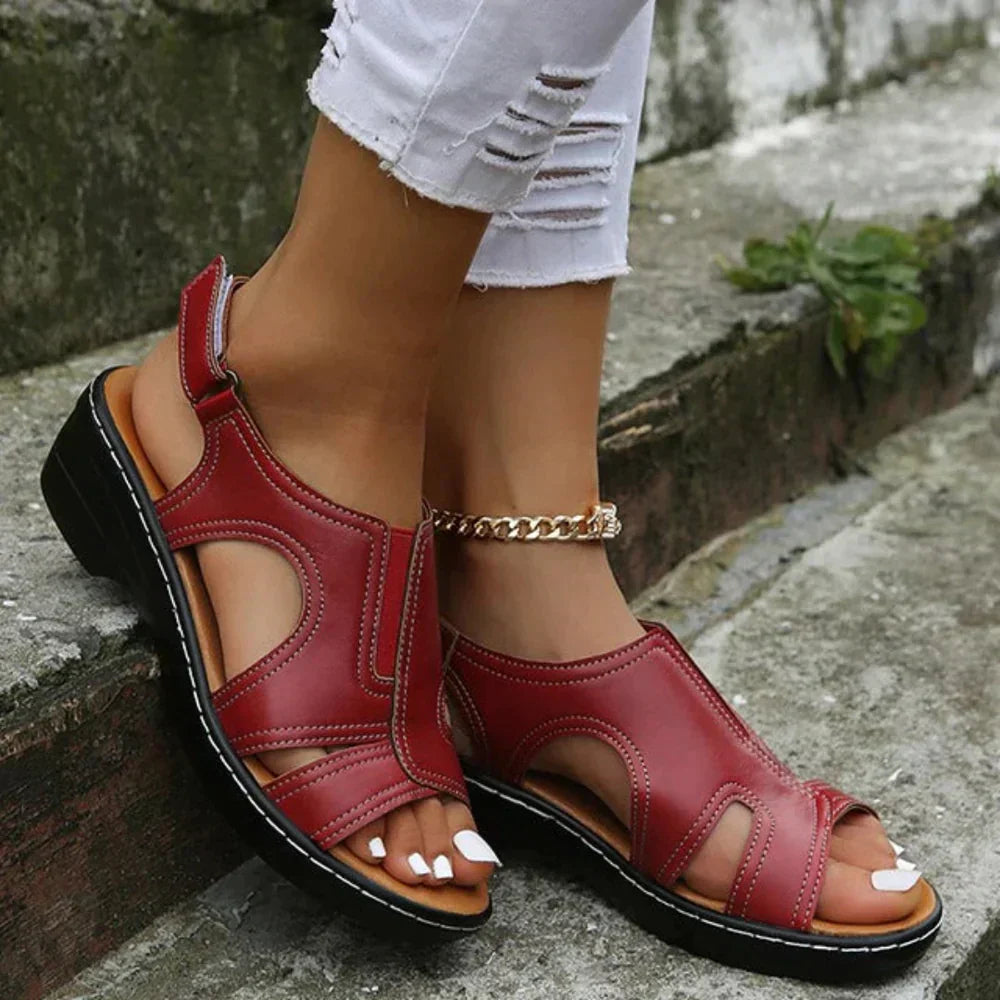 Foot shown wearing comfortable walking sandal with adjustable strap.
