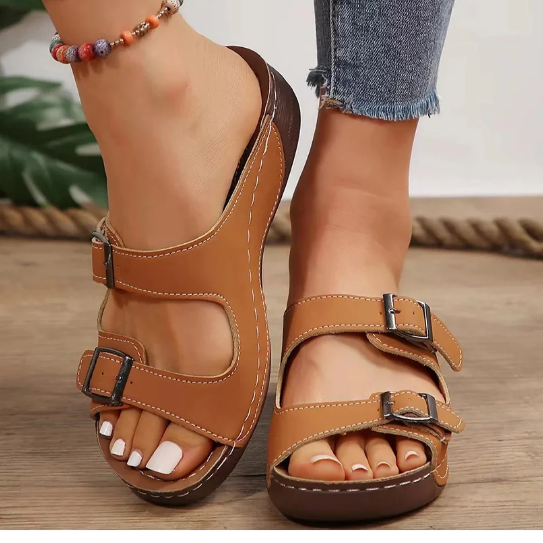 Women’s comfort sandals shown on a female model against a plain background.