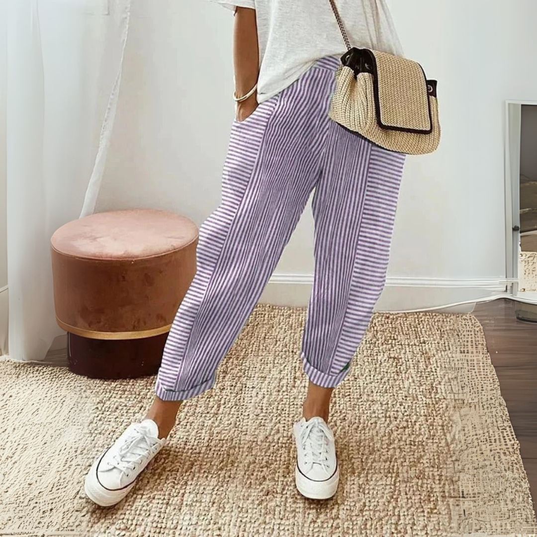 Women’s striped wide leg pants with drawstring waist shown on a plain background.