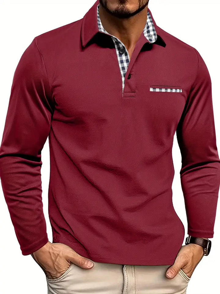 Male model wearing a collared long sleeve polo shirt with a chest pocket on a plain background.