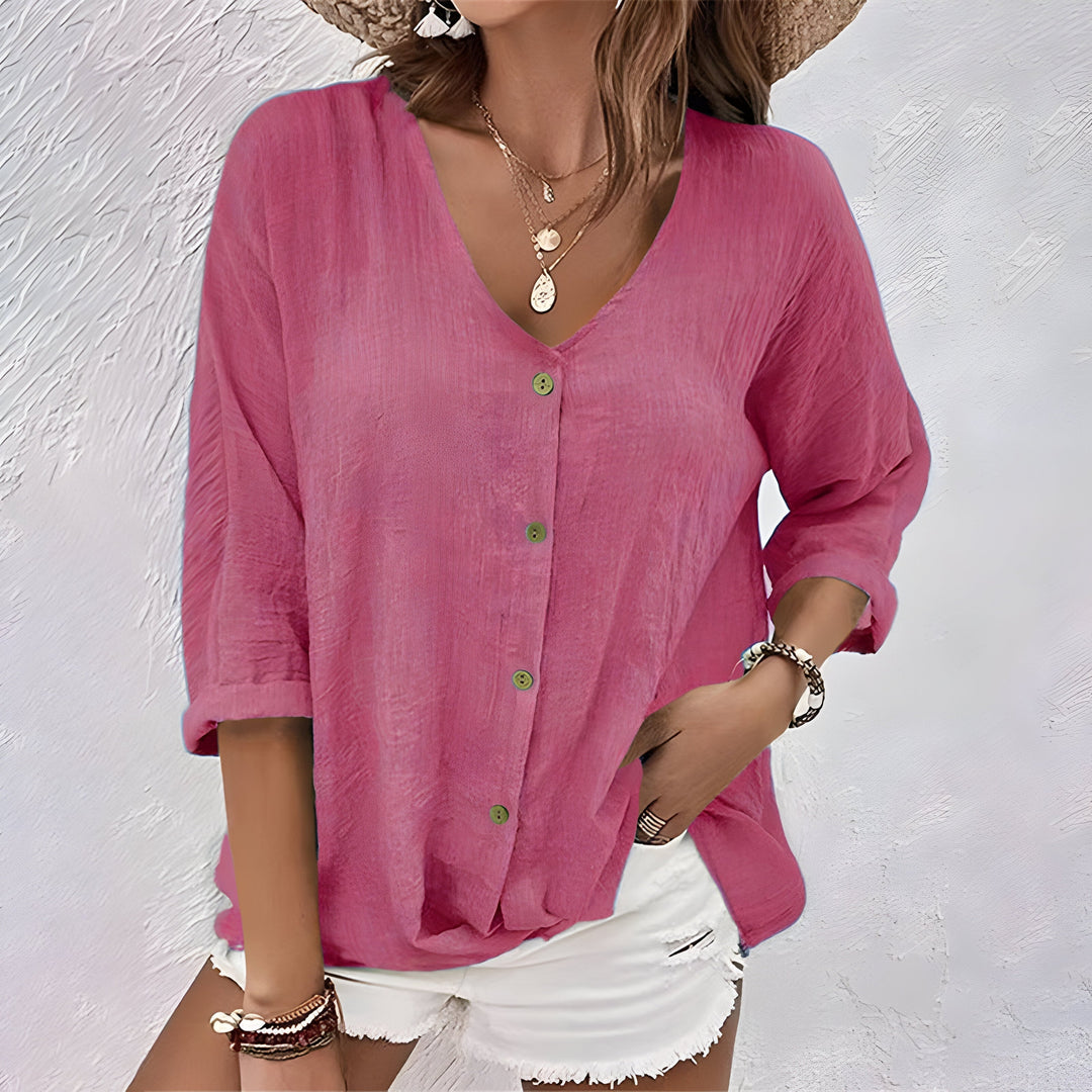 Comfortable long sleeve blouse displayed on a clean background with a relaxed silhouette.