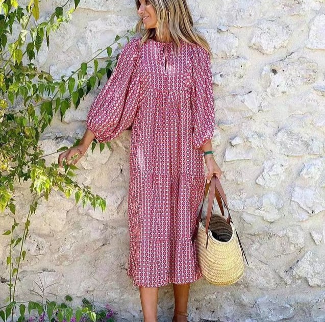 Boho-inspired geometric print maxi dress featured on a female model in studio lighting.