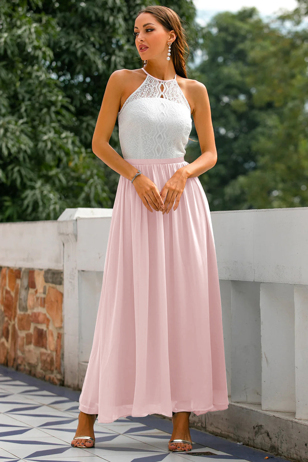 Woman showing side profile of flowing dress in nature.