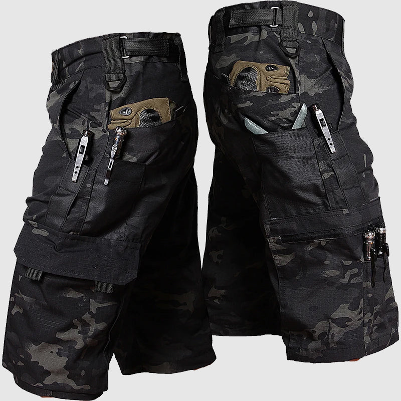 Female model wearing utility cargo pants against a plain background.