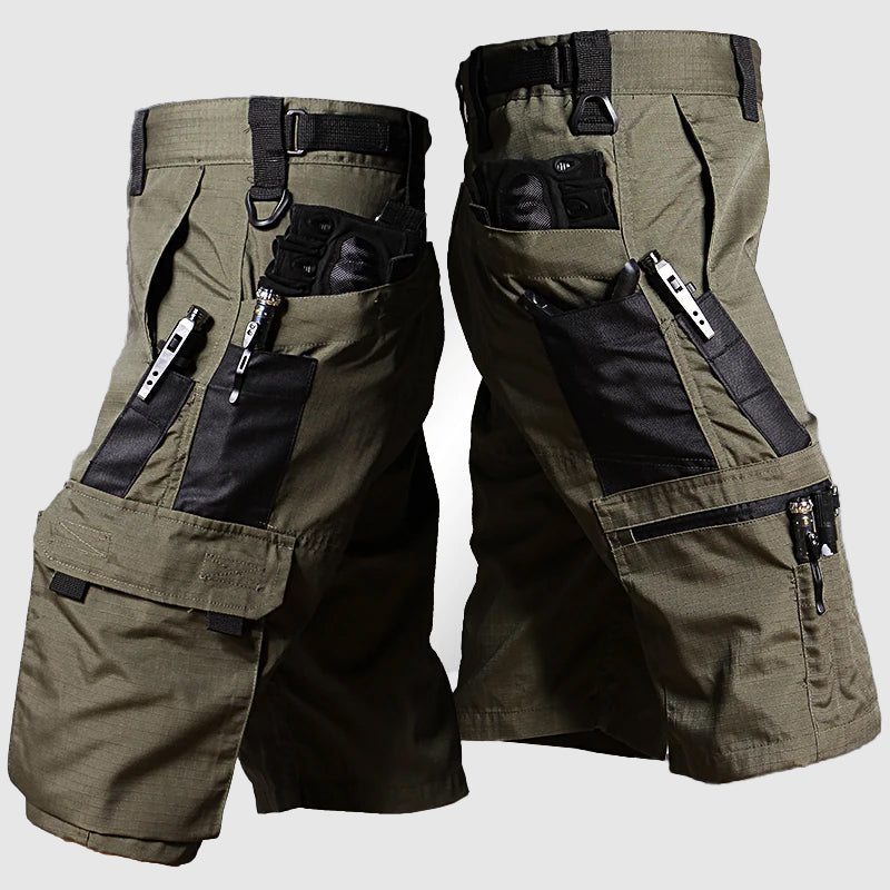 
Model wearing rugged streetwear cargo pants against a plain background.
