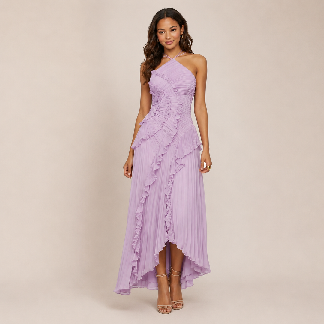 Woman wearing a ruffle halter A-line dress on a plain background.