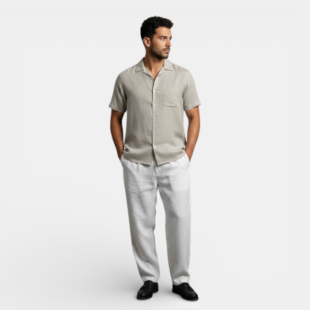  Female model showcasing a relaxed summer shirt on a plain background.