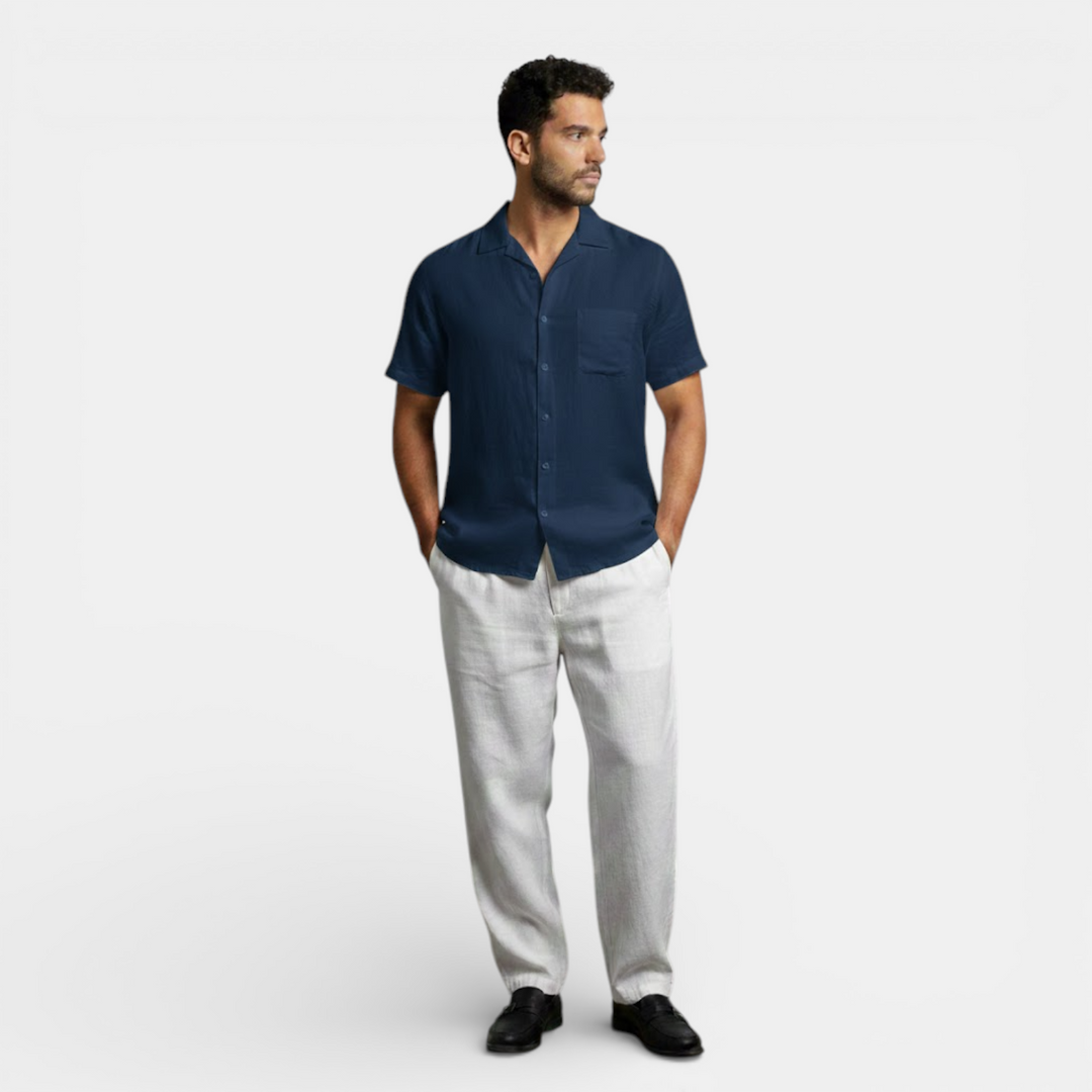 Model in a casual summer shirt shown on a plain background.