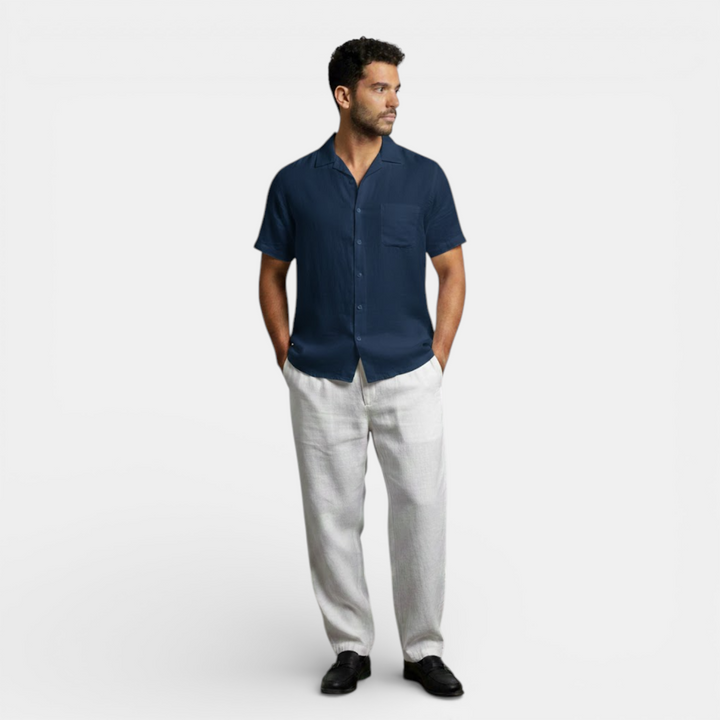 Model in a casual summer shirt shown on a plain background.