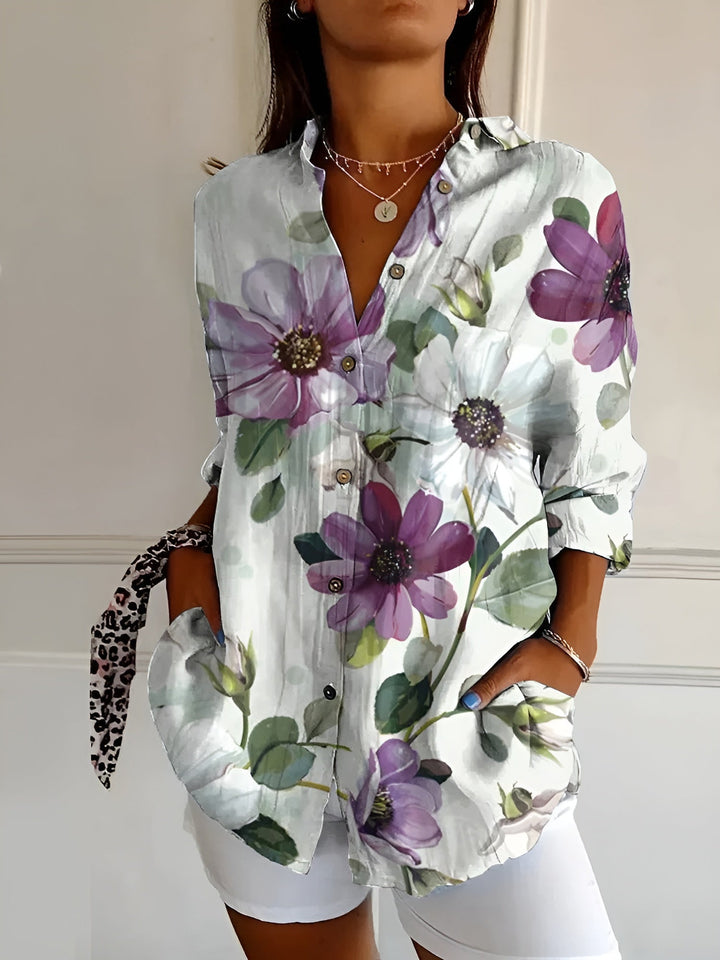 Stylish women’s blouse w/ model on a plain background with graceful silhouette.