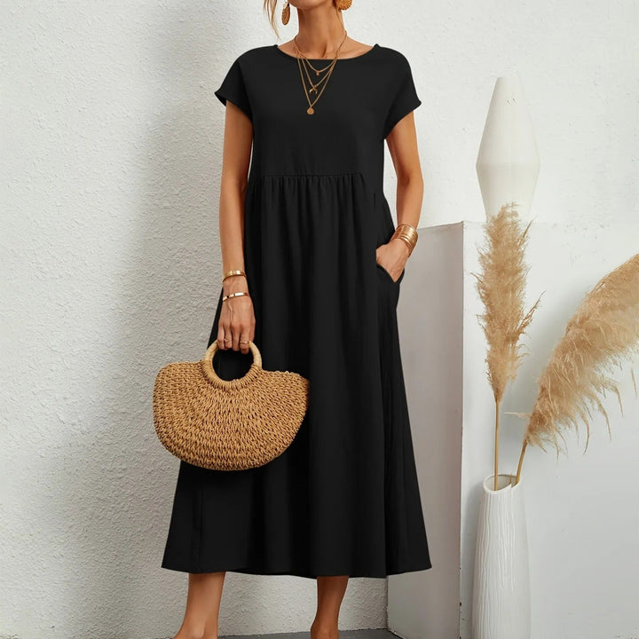 Sophisticated dress featuring a refined neckline and graceful relaxed fit.