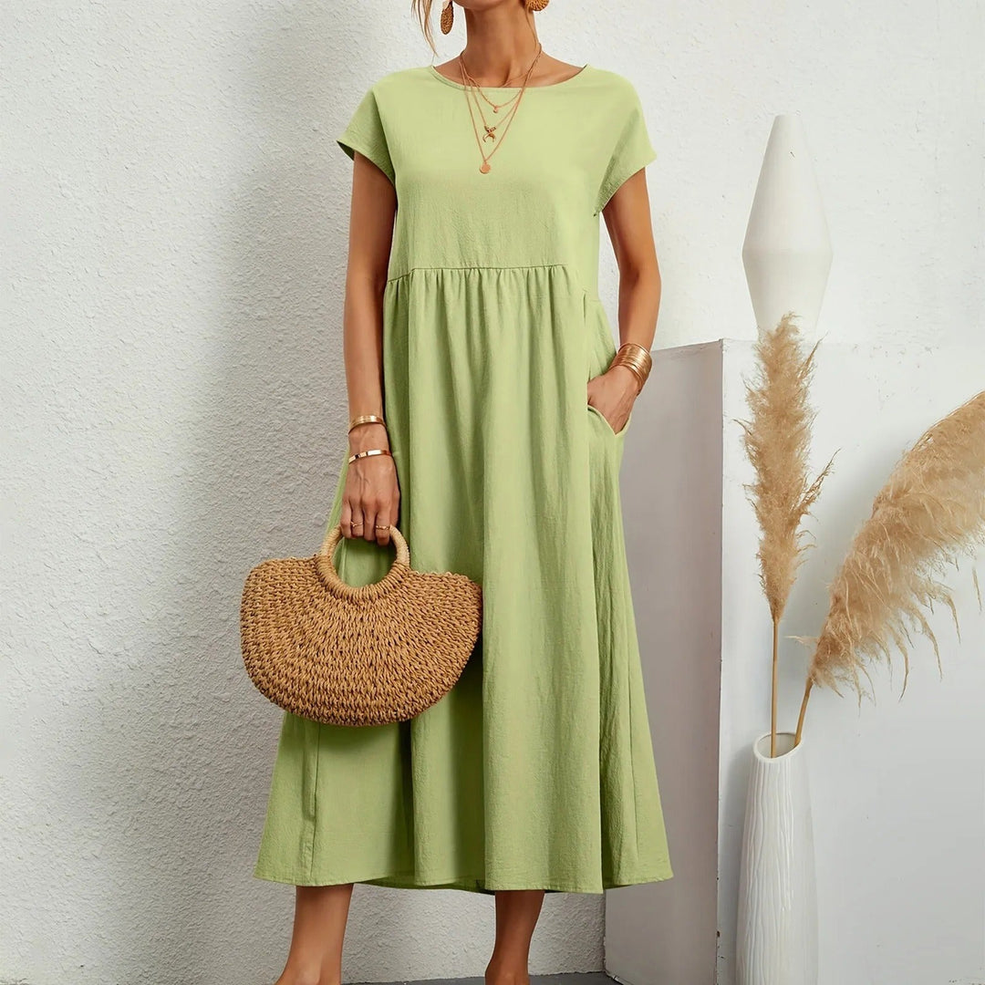 Elegant long dress designed for day-to-evening style and comfort.