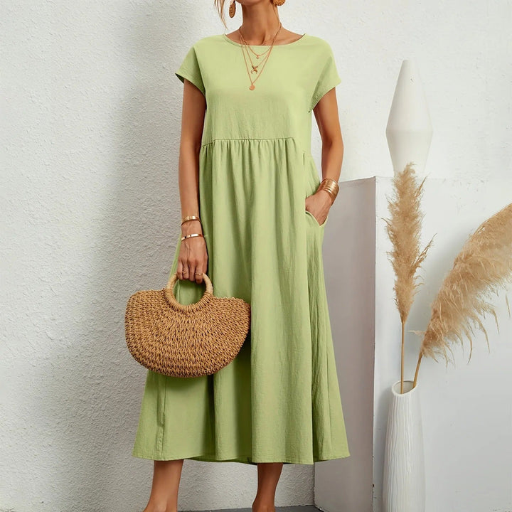 Elegant long dress designed for day-to-evening style and comfort.