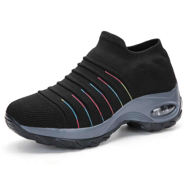 Modern women’s walking shoes shown on a female model with plain background.