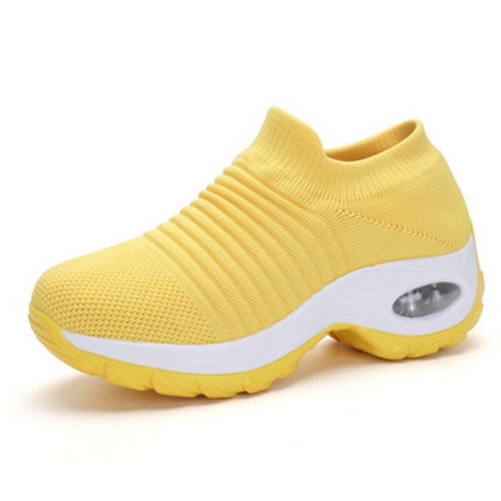 Women’s casual comfort footwear shown on feet with plain studio background.