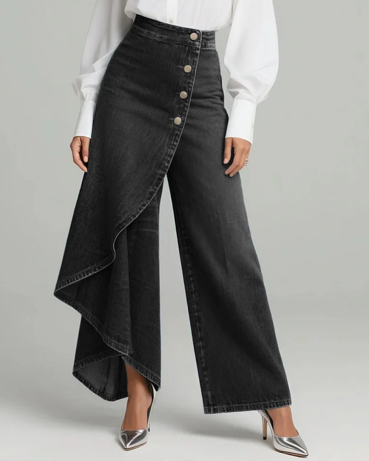 Female model styling wrap waist wide leg pants on a plain backdrop.