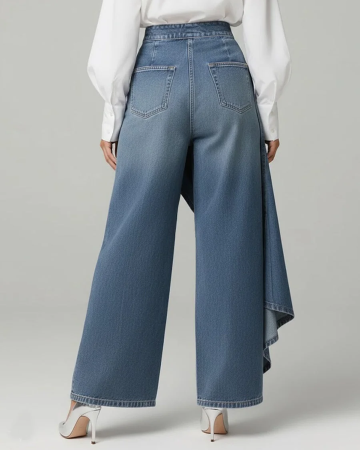 Woman in flowing wide leg wrap pants with a polished everyday look.