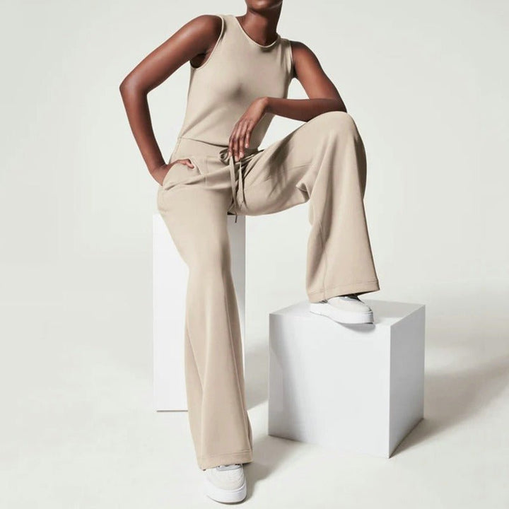 Fashion jumpsuit for women shown on a plain background with a sleek tailored shape.