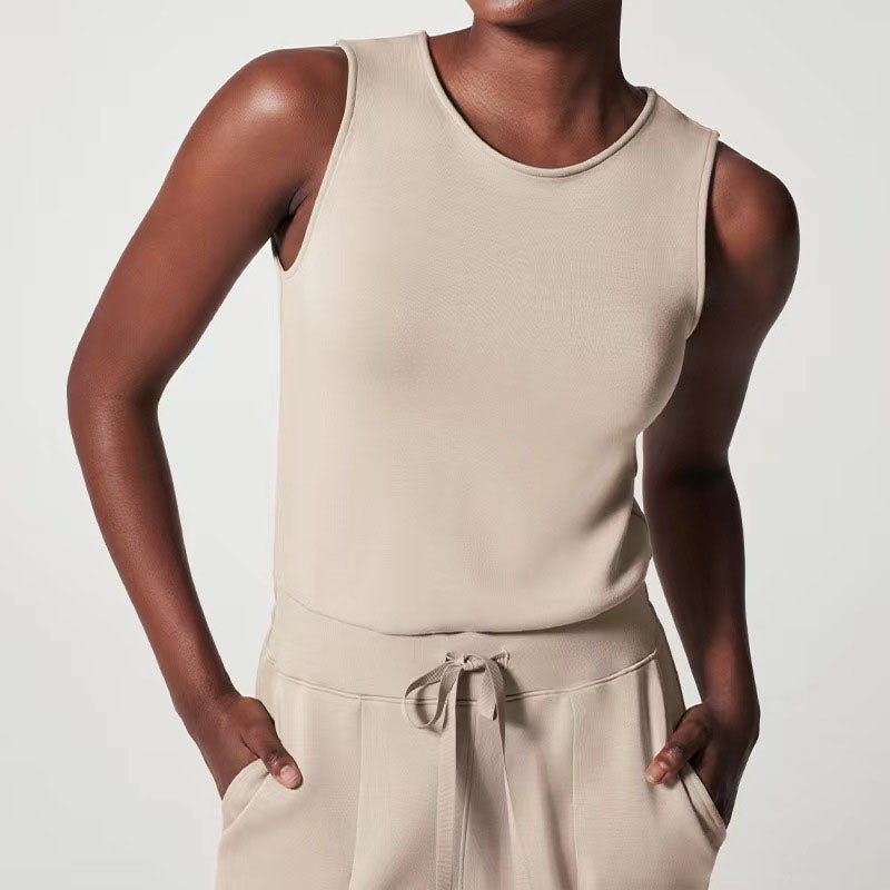 Female model in a soft fabric jumpsuit with a flattering fit against a plain background.