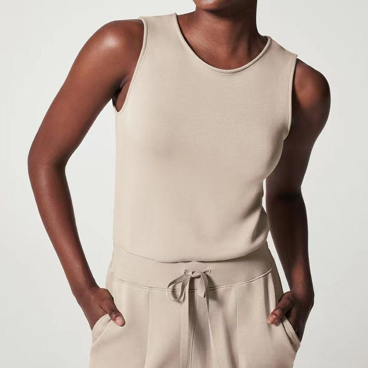 Female model in a soft fabric jumpsuit with a flattering fit against a plain background.