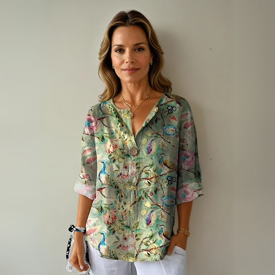 Everyday floral blouse with model on a clean background and easy sleeves.