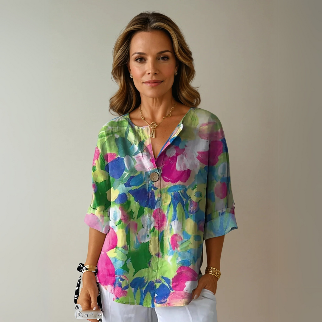Floral button blouse with model on a plain background, ideal for daily outfits.
