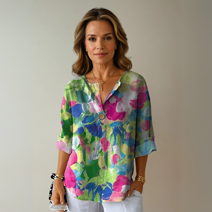 Floral button blouse with model on a plain background, ideal for daily outfits.