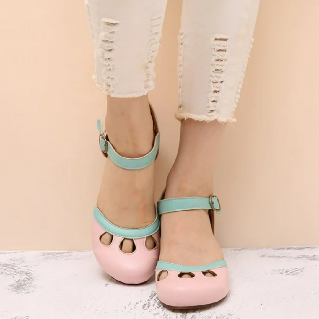 Foot shown in everyday walking sandal with soft insole on plain background.