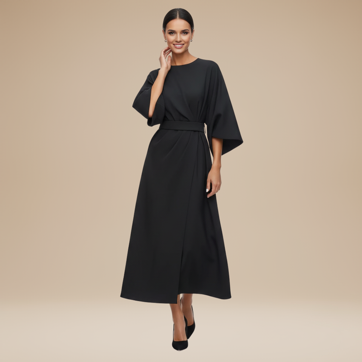 Model in a midi dress with draped front  